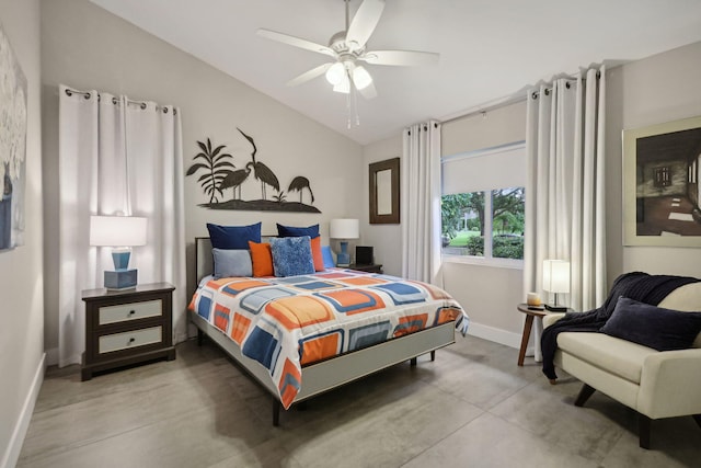 bedroom featuring finished concrete flooring, lofted ceiling, baseboards, and a ceiling fan