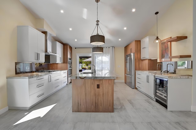 2951 San Remo Way, Delray Beach, FL 33445 - kitchen with appliances with stainless steel finishes, beverage cooler, modern cabinets, a kitchen island with sink, and a sink