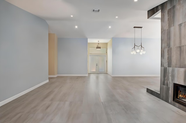 2951 San Remo Way, Delray Beach, FL 33445 - unfurnished living room with a tile fireplace, recessed lighting, baseboards, and vaulted ceiling
