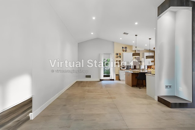 interior space with recessed lighting, baseboards, visible vents, and high vaulted ceiling