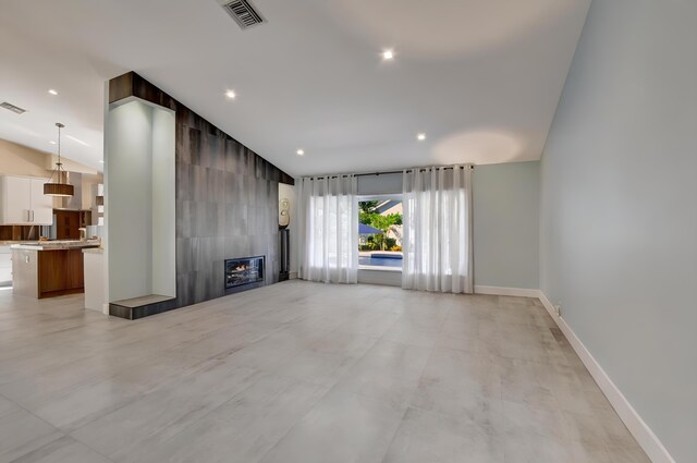 2951 San Remo Way, Delray Beach, FL 33445 - unfurnished living room with lofted ceiling, a fireplace, baseboards, and recessed lighting