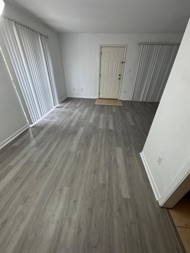 unfurnished living room featuring hardwood / wood-style floors