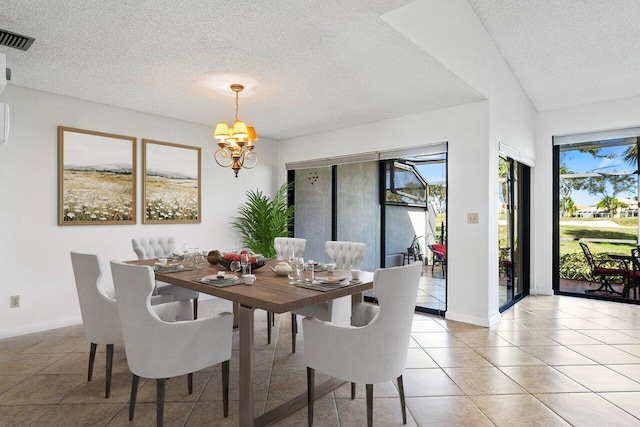 tiled dining room with a chandelier and a textured ceiling