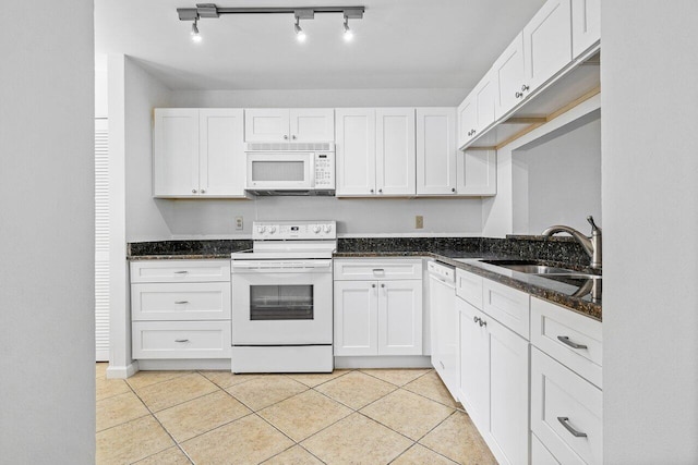 kitchen with white cabinets, white appliances, and sink