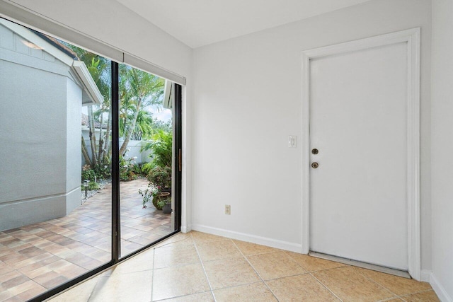 doorway to outside featuring light tile patterned floors