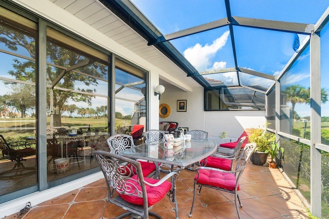 sunroom / solarium featuring lofted ceiling