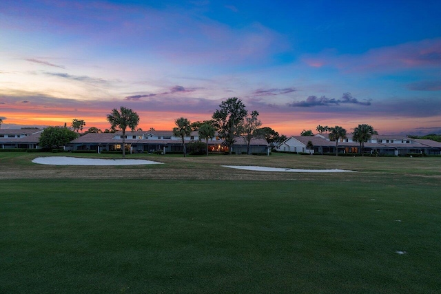 view of yard at dusk