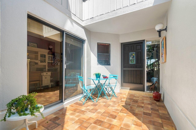 entrance to property featuring a patio area