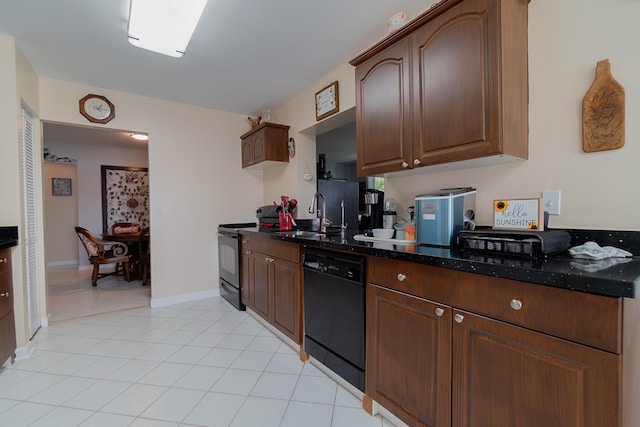 kitchen with light tile patterned floors, dark stone counters, sink, and black appliances