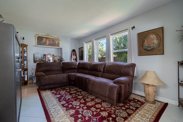 tiled living room with a textured ceiling