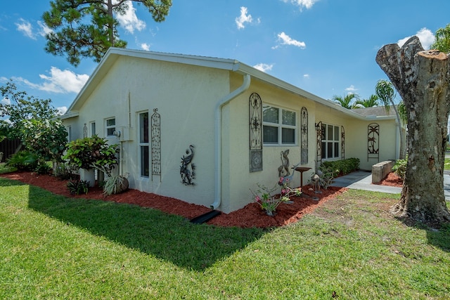 view of home's exterior featuring a lawn