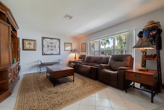 living room with light tile patterned floors and a textured ceiling