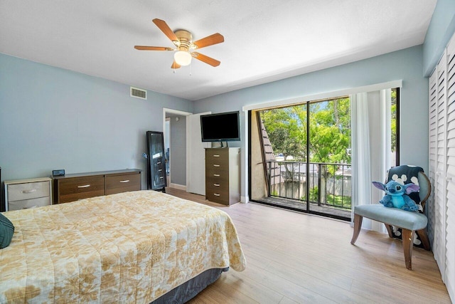 bedroom with multiple windows, access to exterior, ceiling fan, and light hardwood / wood-style floors