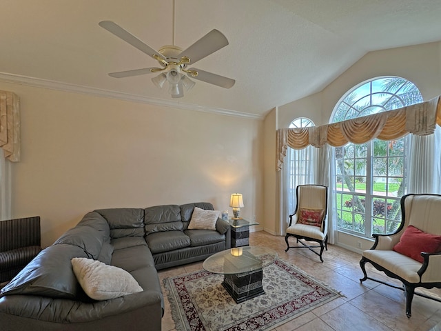 living room featuring a wealth of natural light, lofted ceiling, ceiling fan, and light tile patterned floors