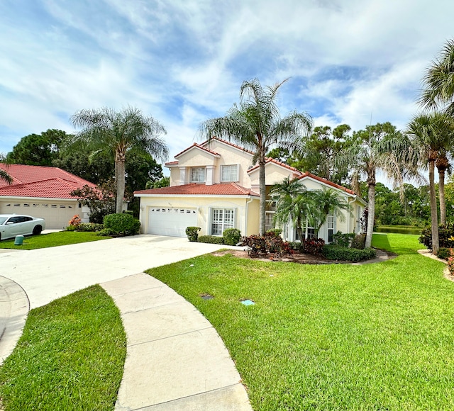 view of front of home with a front lawn and a garage