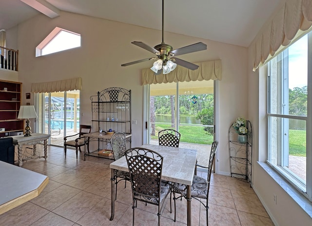 tiled dining space with high vaulted ceiling, ceiling fan, and beamed ceiling