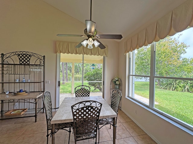 dining room with ceiling fan and light tile patterned flooring