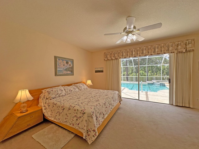 bedroom with a textured ceiling, carpet flooring, ceiling fan, and access to exterior