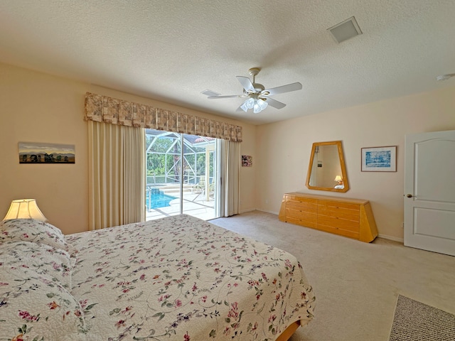 carpeted bedroom with a textured ceiling, access to outside, and ceiling fan