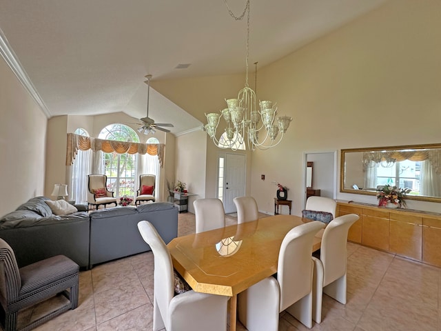 tiled dining area featuring ceiling fan with notable chandelier, crown molding, and vaulted ceiling