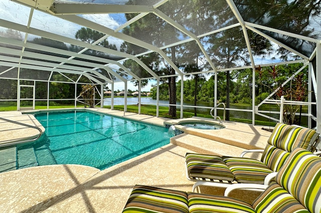 view of swimming pool with a water view, glass enclosure, and an in ground hot tub