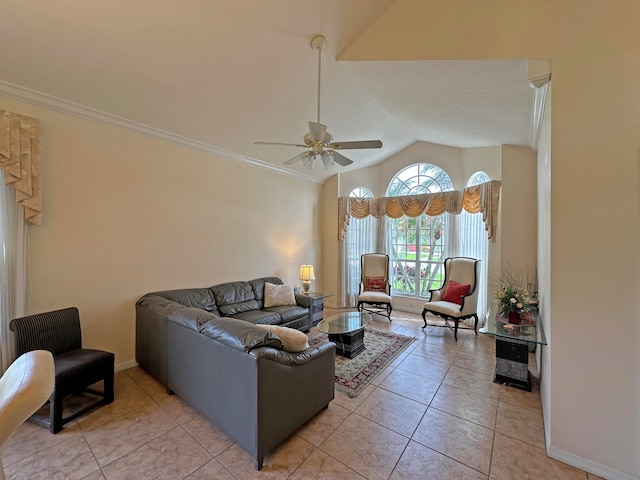 tiled living room featuring lofted ceiling, ornamental molding, and ceiling fan