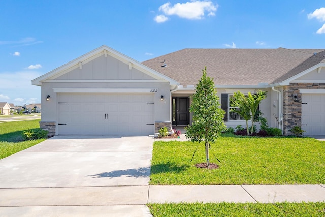 ranch-style house with a front lawn and a garage