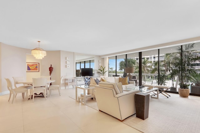 living room with a wall of windows and a chandelier