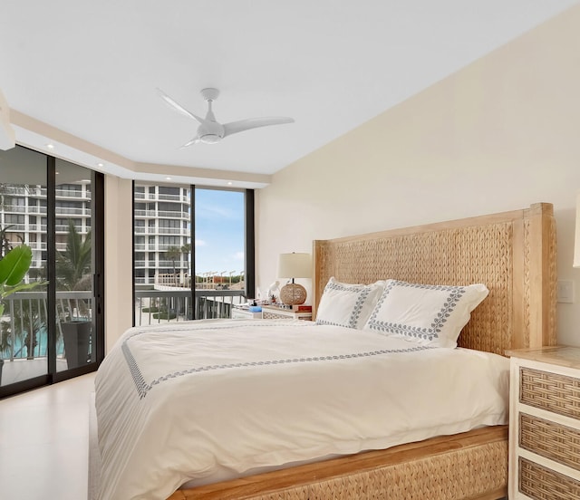 bedroom with floor to ceiling windows, ceiling fan, and access to exterior