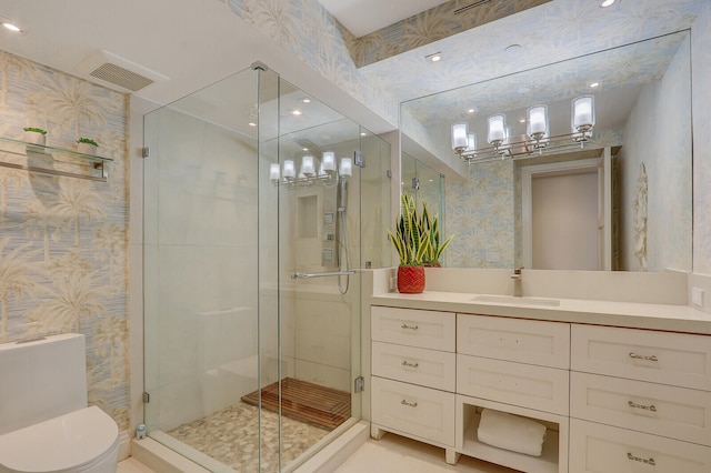 bathroom featuring walk in shower, vanity, and toilet