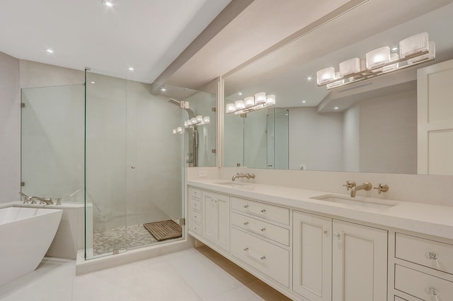 bathroom featuring tile patterned flooring, independent shower and bath, and vanity