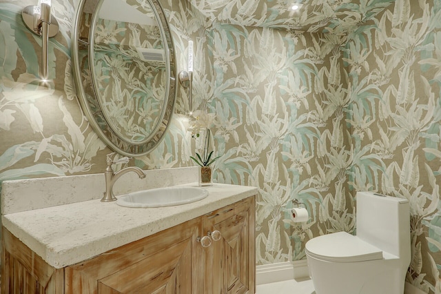 bathroom with vanity and toilet