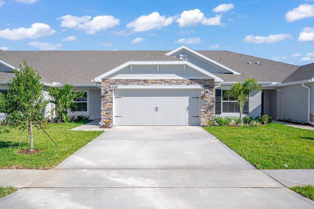 view of front of house featuring a front yard and a garage