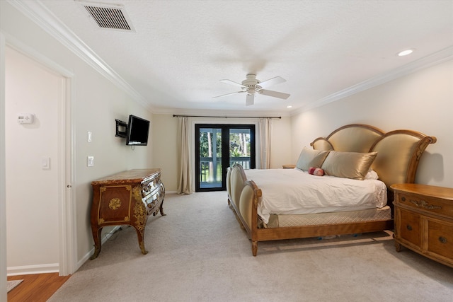 bedroom featuring ceiling fan, a textured ceiling, light wood-type flooring, crown molding, and access to exterior