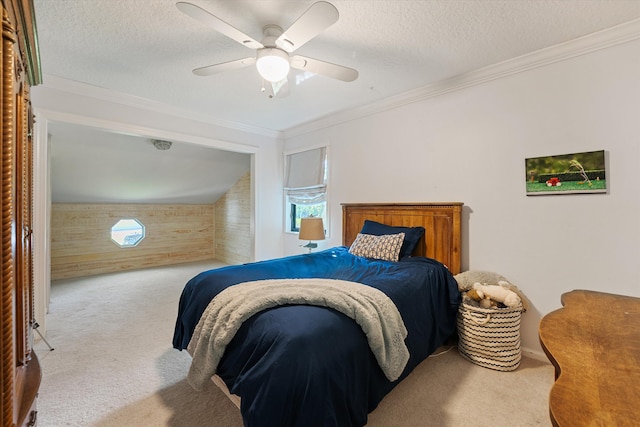 bedroom featuring wood walls, ceiling fan, light colored carpet, and crown molding