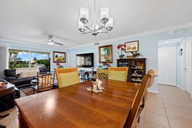 dining space with ceiling fan with notable chandelier, ornamental molding, and light tile patterned floors