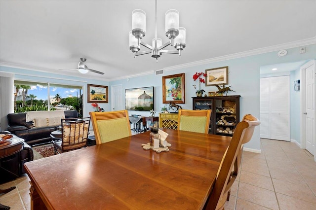 tiled dining area with ceiling fan with notable chandelier and crown molding