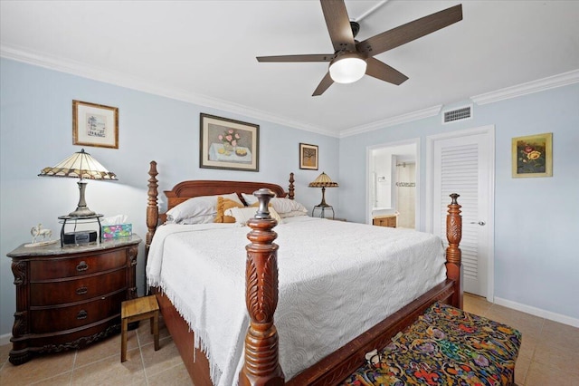 tiled bedroom with ceiling fan, ornamental molding, and ensuite bath