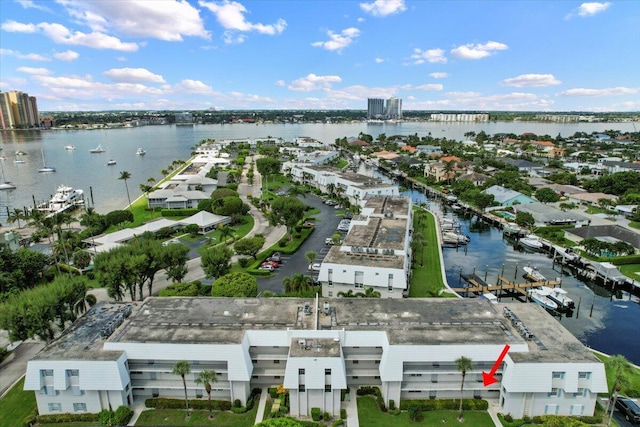 birds eye view of property with a water view