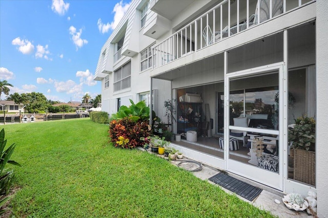 view of yard with a balcony