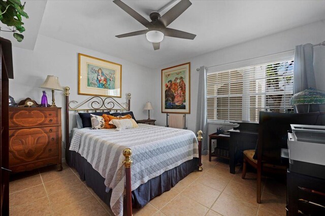 tiled bedroom with ceiling fan