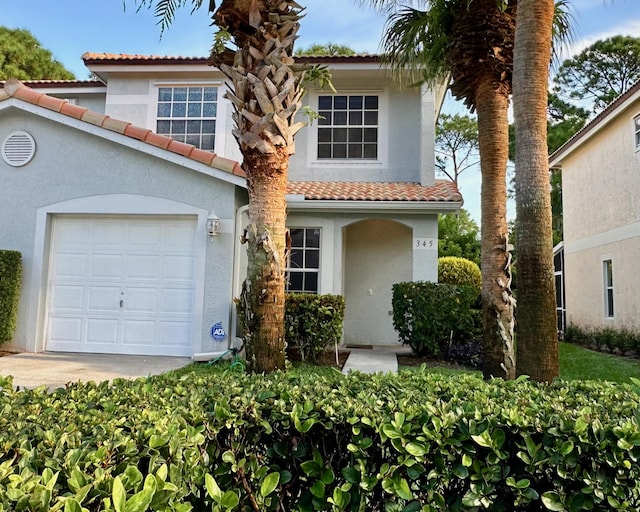 view of front of property with a garage