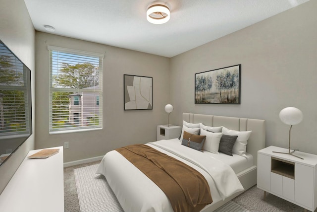 bedroom featuring light colored carpet