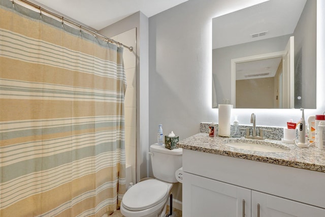 full bathroom featuring vanity, shower / tub combo, and toilet