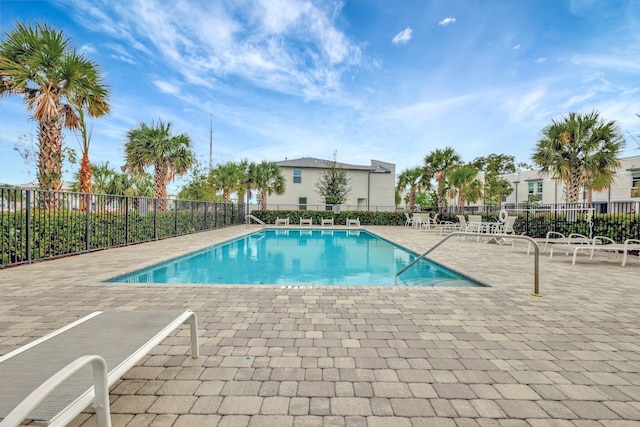 view of swimming pool with a patio area