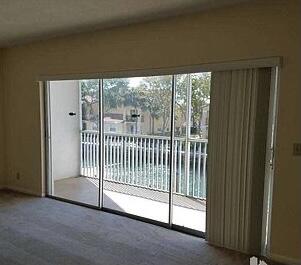 entryway featuring a wealth of natural light and carpet floors