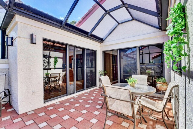 sunroom / solarium with vaulted ceiling