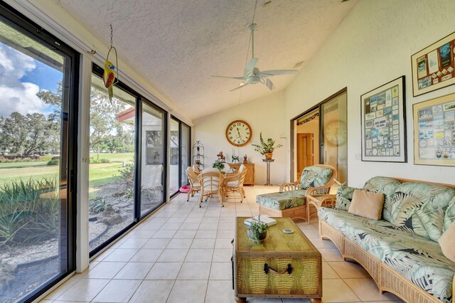 sunroom / solarium featuring lofted ceiling and ceiling fan