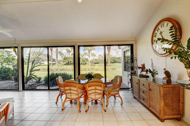 tiled dining room featuring ceiling fan