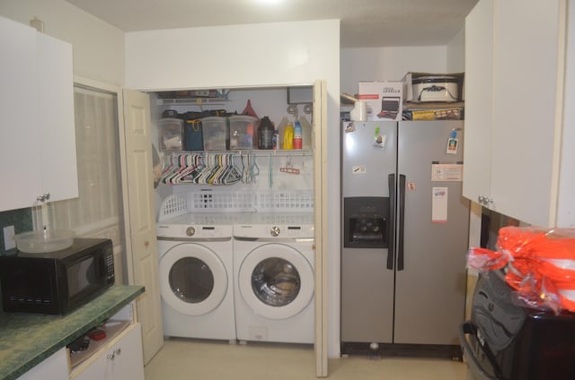 laundry area with independent washer and dryer